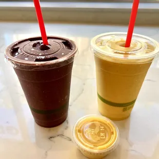 two cups of iced coffee on a table