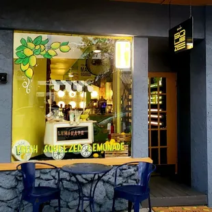 a table and chairs outside of a restaurant