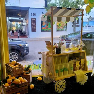 a lemonade stand in a store window