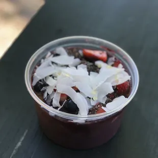 a dessert in a plastic cup