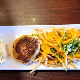 The Hangover soft scramble eggs , crab cake with shoestring fries with queso