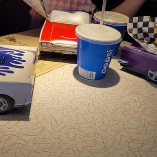 Kids meals come in cool car containers.