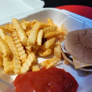 a hamburger, french fries, ketchup and ketchup