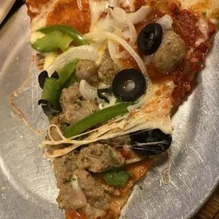 A close up of the uncooked veggies on the Anthony's pizza