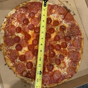 You pay for a 16" pizza but you get a 14" pizza. When you question it to the staff they tell you its 16"