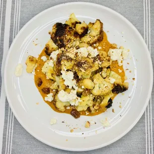 Roasted Cauliflower 
Romesco Sauce, feta cheese, golden raisins, toasted almonds