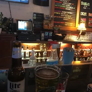 a glass of beer on the bar