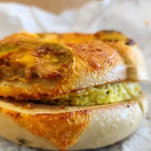 a close up of a bagel sandwich