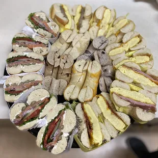 Bagel party tray, assorted toasted bagels with side cream cheese, Lox sandwich and breakfasts.