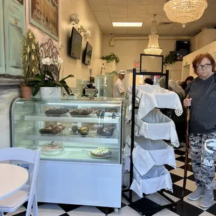 a woman standing in front of the counter