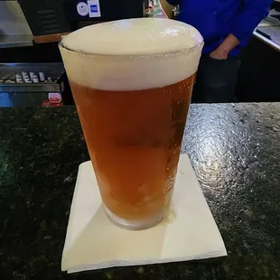 a pint of beer on the bar