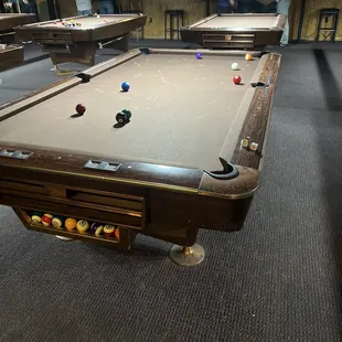 a pool table in the foreground