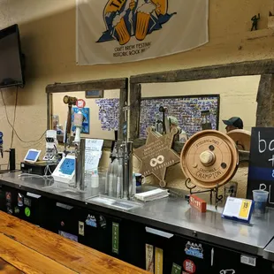 a row of beer taps