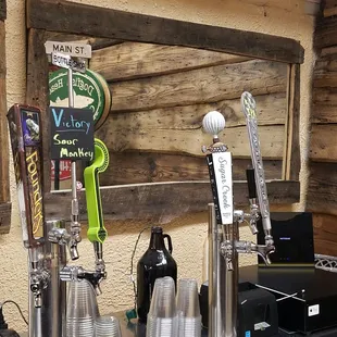 a row of beer taps