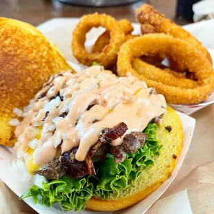 a hamburger and onion rings