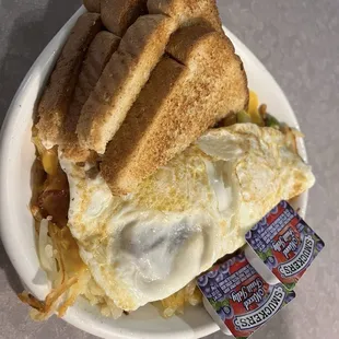 Two eggs over easy with wheat toast, and hash browns.