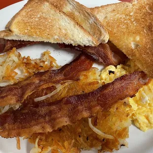 Delicious scrambled eggs, hash browns, bacon &amp; toast
