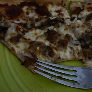 Sausage, mushroom, and onion pizza.