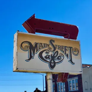 Main street cafe sign.  Needed repair for night lighting, fine during the day.