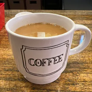 a cup of coffee on a counter