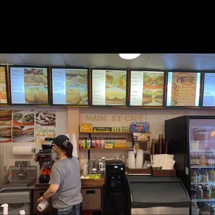 a man ordering food at the counter