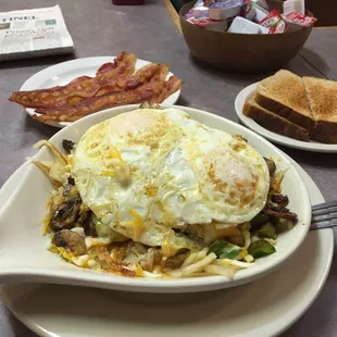 Hobo breakfast with a side of bacon.  The food was deliciously hot, the coffee is great.  It doesn&apos;t get any better than this.