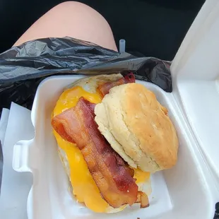 Breakfast homemade biscuit sandwich with cheese, bacon and egg.