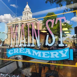 the reflection of a building in the window