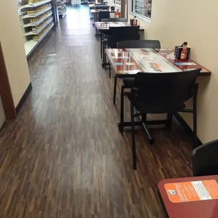 Tables skirt along pharmacy.  Separate dining room if you prefer.