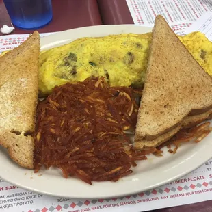 Kitchen sink (meat and veggie mix) omelette with hash browns and toast!
