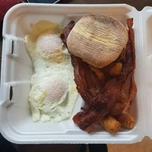 2 egg with meat breakfast platter with eggs over medium