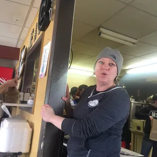 a woman opening a door