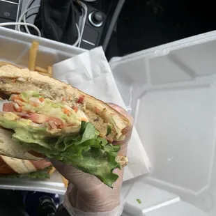 a sandwich in a styrofoam container