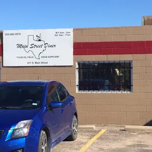 blue car in parking lot