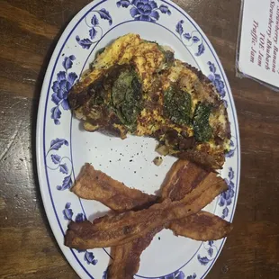 Spinach and mushroom omelet with a side of bacon (toast offered)