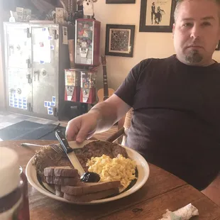 Steak, eggs, hash browns, toast and blackberry butter.