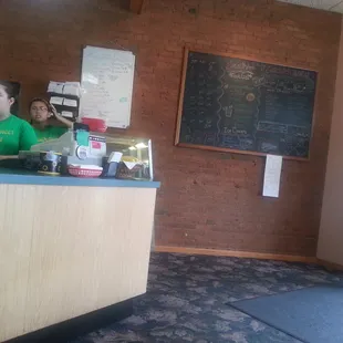 two people standing at the counter