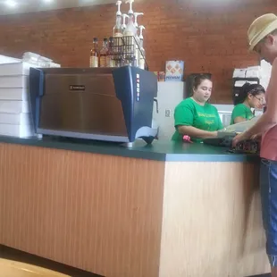 a woman standing at a counter