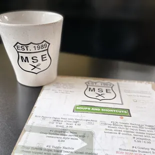 a coffee cup and menu