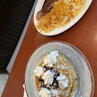 Blueberry pancakes, hash browns, eggs, sausage