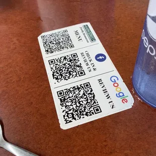 Social media QR codes on the tables.