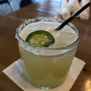 a margarita with a slice of jalapeno