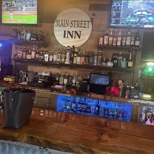 a bar with a television and a television