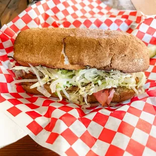 a sub sandwich in a basket
