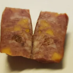 The beer and cheese meat stick pieces.