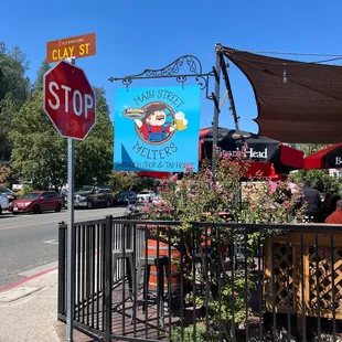 a stop sign and a restaurant
