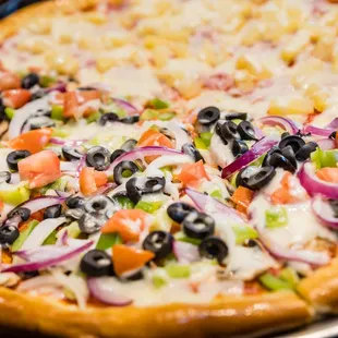 two pizzas with different toppings