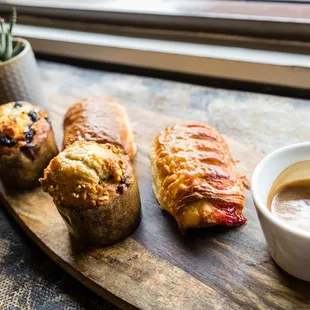 three pastries and a cup of coffee