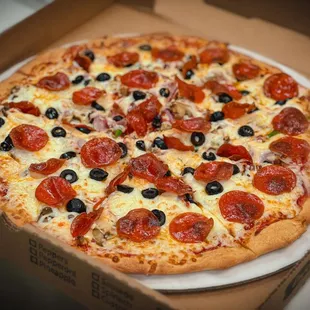 15 inch super special pizza, loaded with pepperoni, olives, ham, sausage, onion, green pepper, and mushrooms.