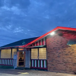 This bright red light tracing the roof of Main Street I like